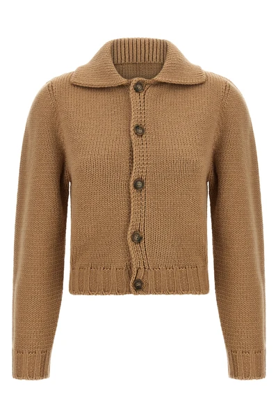 the maison margiela mm6 cardigan redefines knitwear codes through a cropped silh