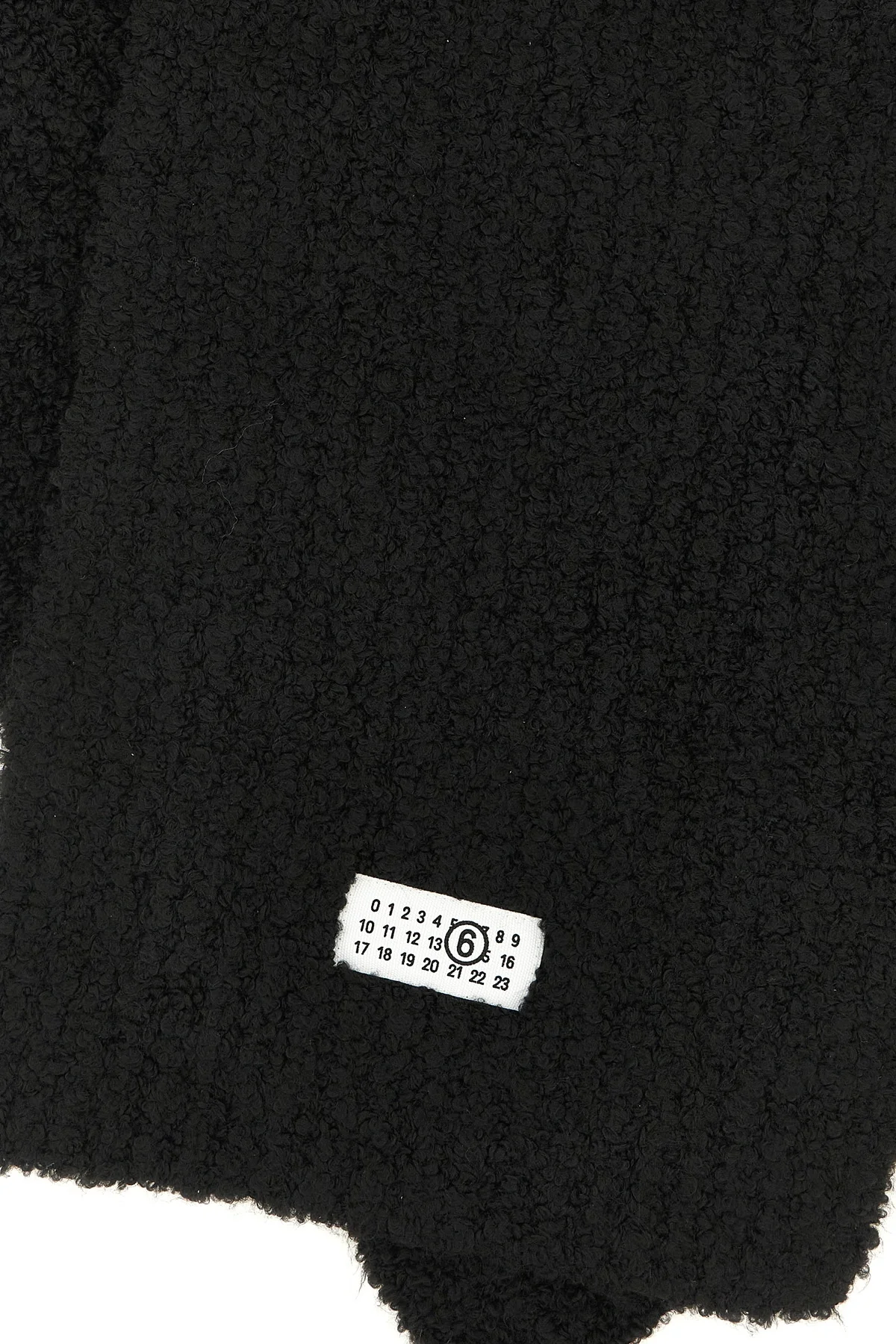 the maison margiela mm6 scarf is distinguished by an elongated rectangular const