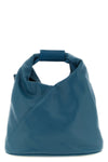 maison margielas mm6 japanese crossbody bag defines space through a rigorous
