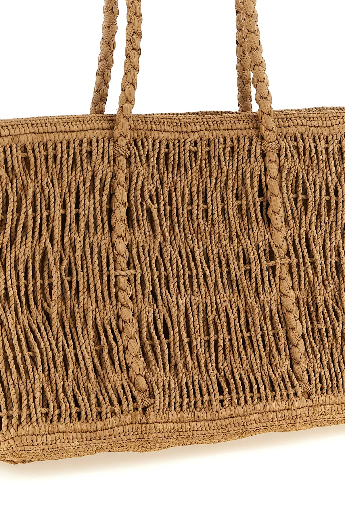 the row georgica tote bag is handcrafted in natural palm fibers