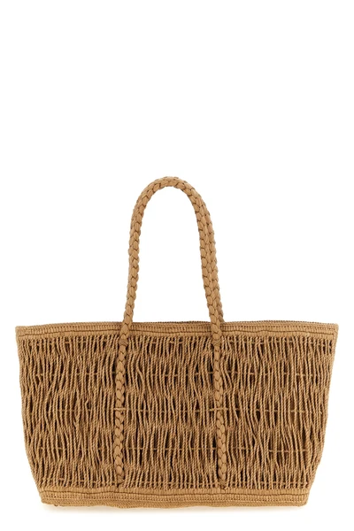 the row georgica tote bag is handcrafted in natural palm fibers
