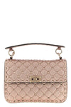 rockstud spike shoulder bag in laminated nappa leather