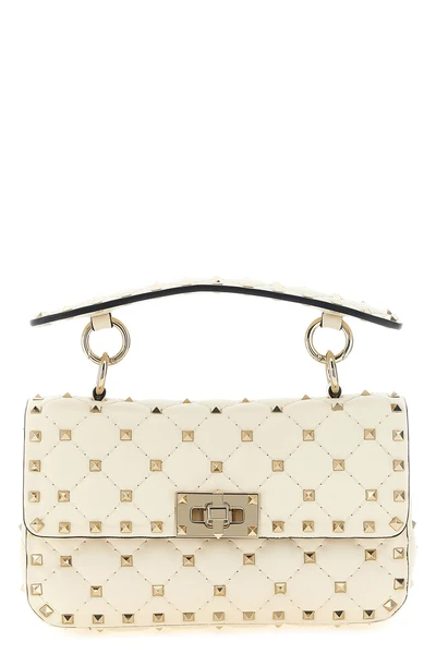 the valentino garavani rockstud spike small shoulder bag in soft lamb nappa is