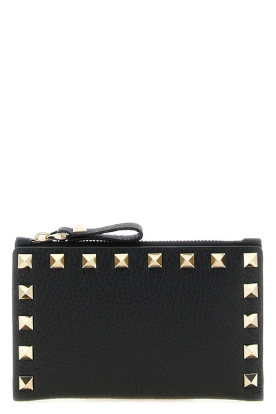 the valentino garavani rockstud cardholder in garnet calf leather represents an