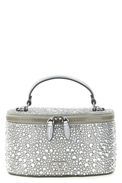 the valentino garavani vanity mini handbag reinterprets the classic silhouette
