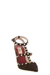 the valentino garavani rockstud pumps define the silhouette through a t-struct