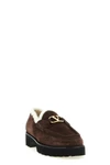 valentino garavani loafers redefine everyday elegance through a structured silho