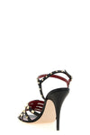 valentino garavani sandals define a bold silhouette through a construction in fi