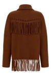 the guest in residence western fringe knitted jacket redefines frontier codes