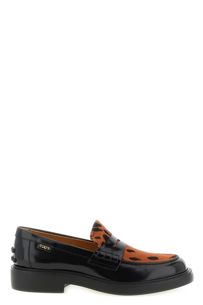 the tods moccasins has a structured construction that blends classic elegance